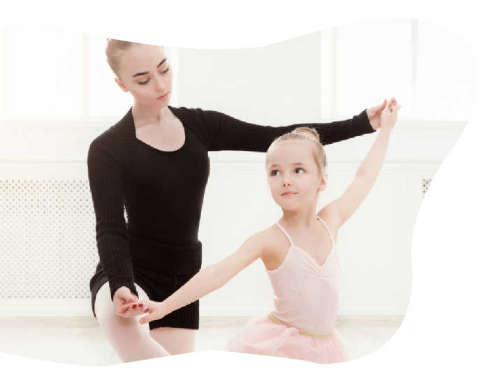 Ballet dancer teaching a child ballet